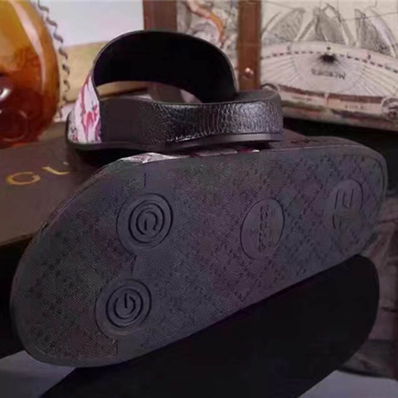 G*u*i bird and flower flip flops